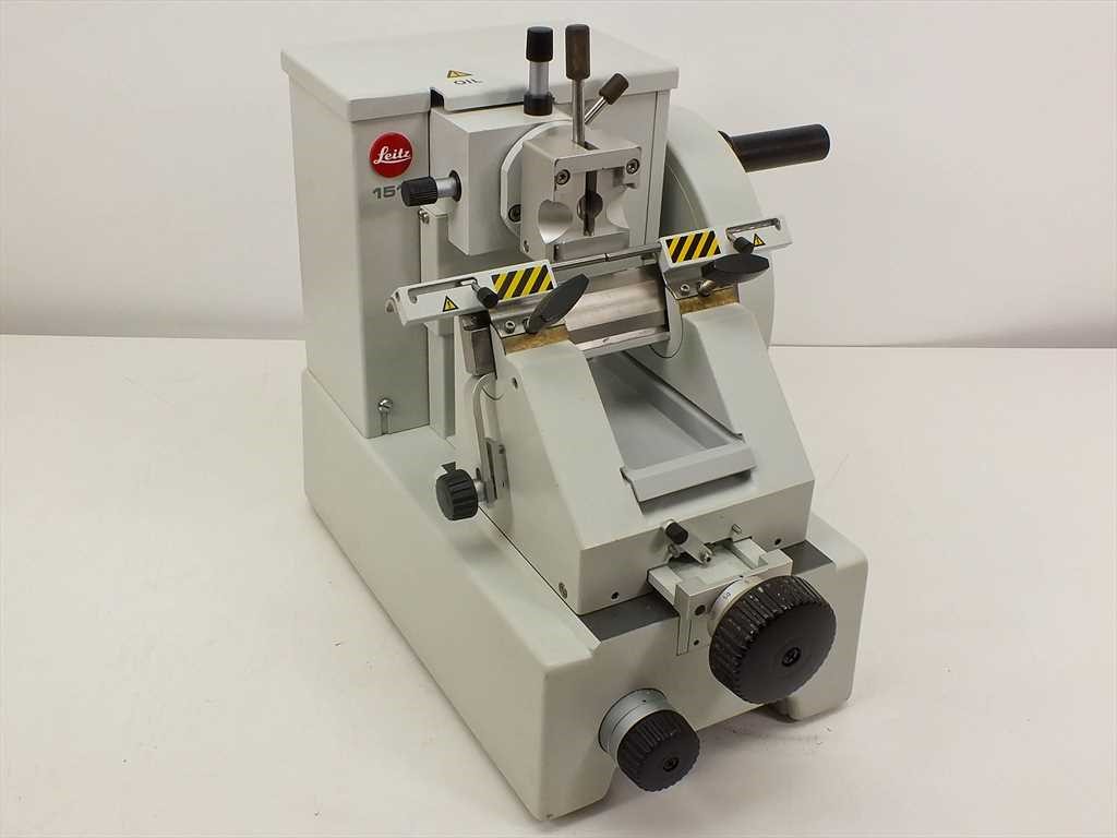 Microtome with finger guards engaged and highlighted.