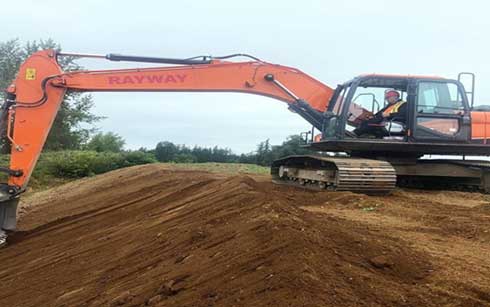 Excavation project showing benching and sloping.